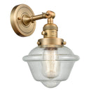 Oxford Sconce shown in the Brushed Brass finish with a Seedy shade