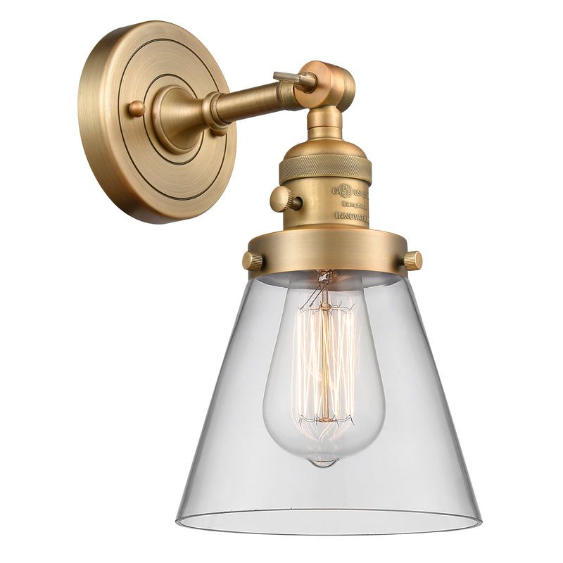 Cone Sconce shown in the Brushed Brass finish with a Clear shade