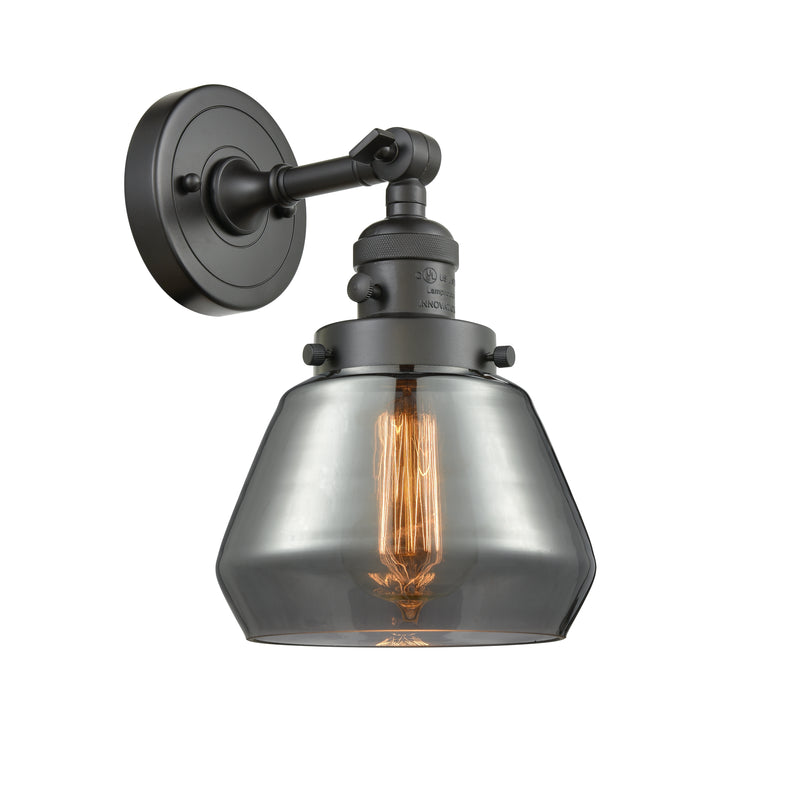 Innovations Lighting Fulton 1-100 watt 7 inch Oil Rubbed Bronze Sconce with Smoked glass and Solid Brass 180 Degree Adjustable Swivel With Engraved Cast Cup Includes a "High-Low-Off" Switch. 203SWOBG173