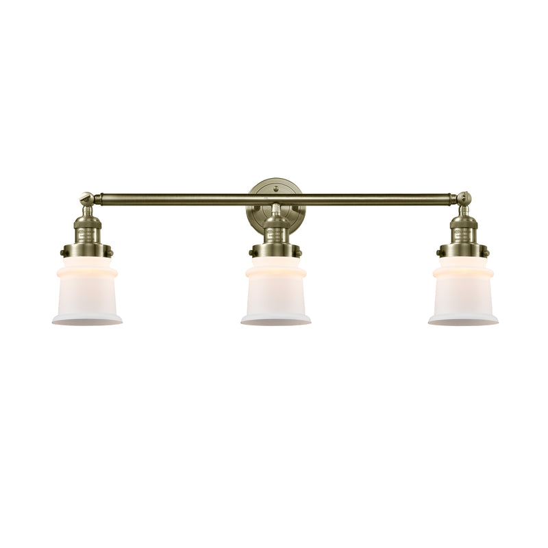 Canton Bath Vanity Light shown in the Antique Brass finish with a Matte White shade