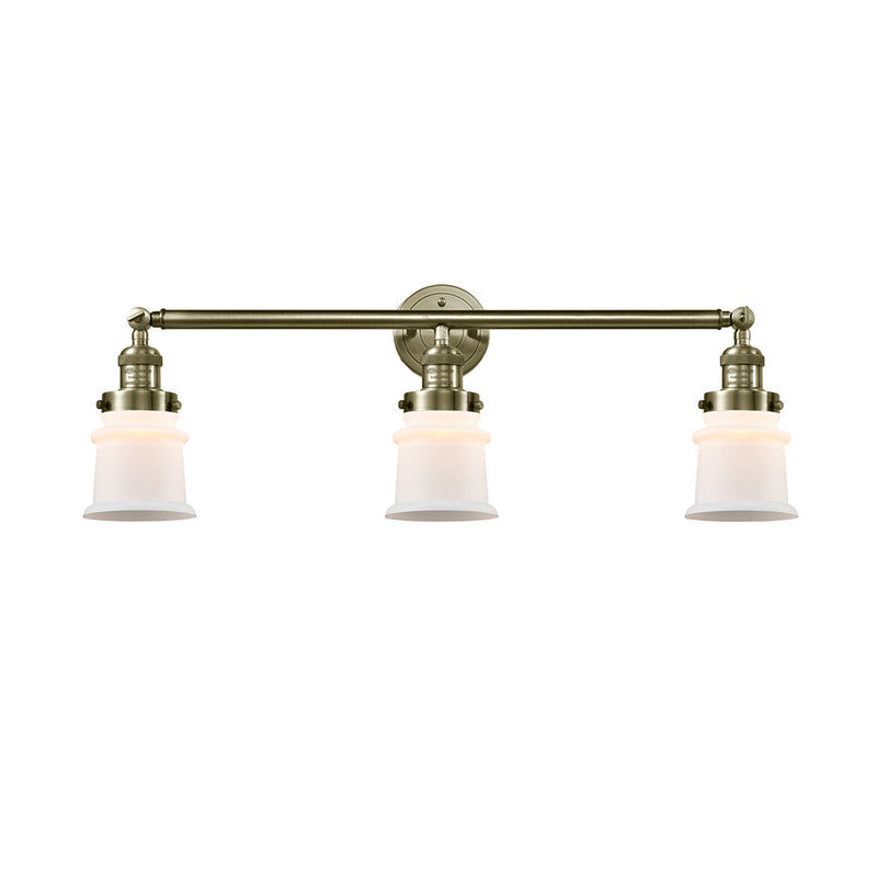 Canton Bath Vanity Light shown in the Antique Brass finish with a Matte White shade