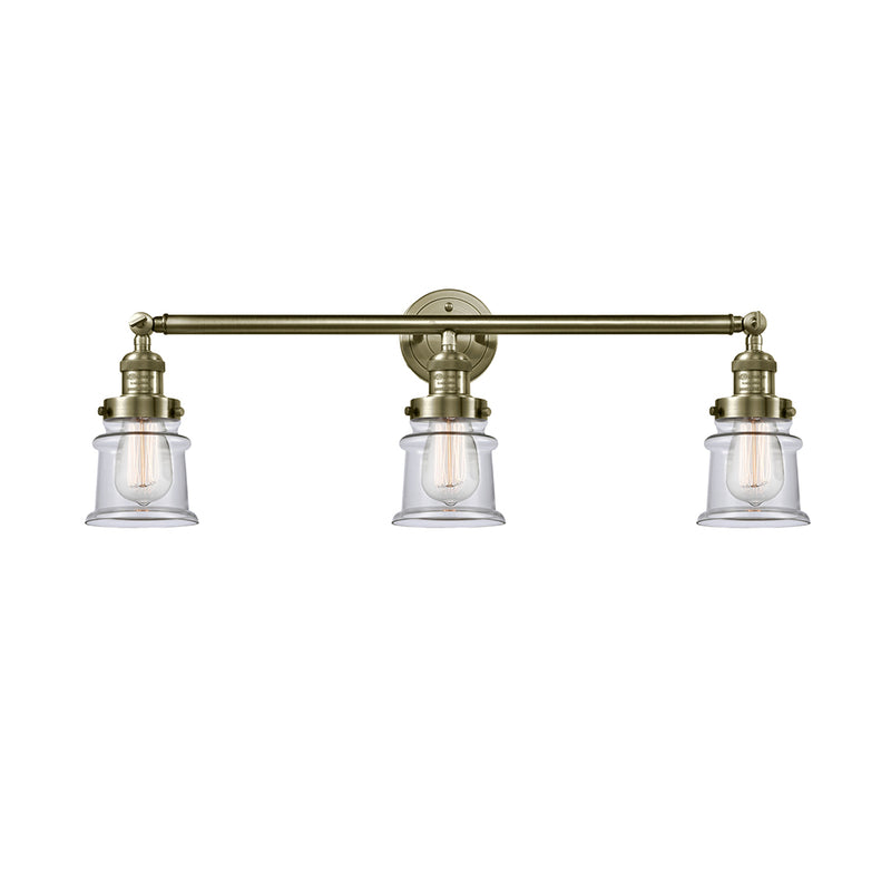 Canton Bath Vanity Light shown in the Antique Brass finish with a Clear shade