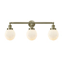 Beacon Bath Vanity Light shown in the Antique Brass finish with a Matte White shade