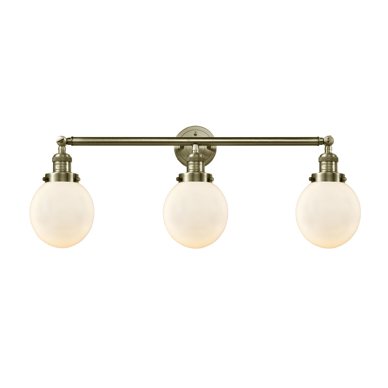 Beacon Bath Vanity Light shown in the Antique Brass finish with a Matte White shade