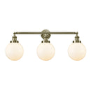 Beacon Bath Vanity Light shown in the Antique Brass finish with a Matte White shade