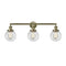 Beacon Bath Vanity Light shown in the Antique Brass finish with a Clear shade