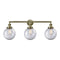 Beacon Bath Vanity Light shown in the Antique Brass finish with a Clear shade