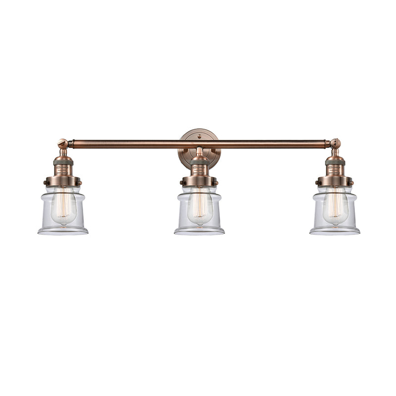 Canton Bath Vanity Light shown in the Antique Copper finish with a Clear shade