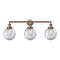 Beacon Bath Vanity Light shown in the Antique Copper finish with a Clear shade