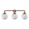 Beacon Bath Vanity Light shown in the Antique Copper finish with a Clear shade