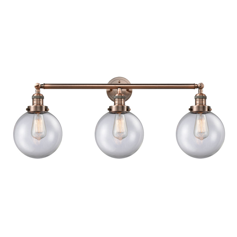 Beacon Bath Vanity Light shown in the Antique Copper finish with a Clear shade