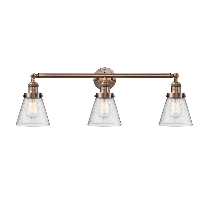 Cone Bath Vanity Light shown in the Antique Copper finish with a Seedy shade