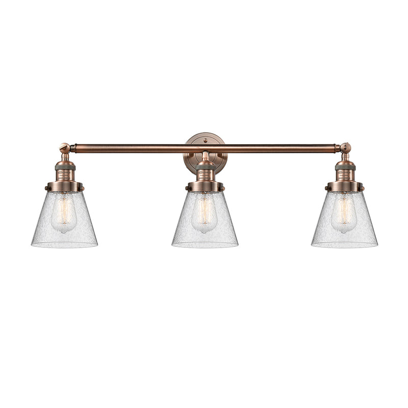 Cone Bath Vanity Light shown in the Antique Copper finish with a Seedy shade