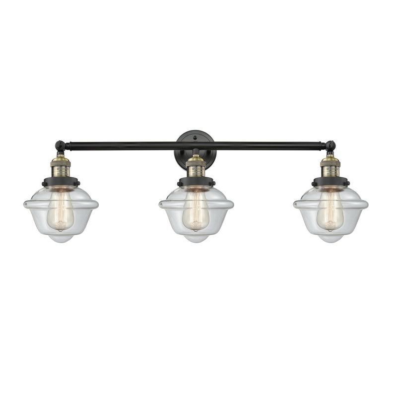 Oxford Bath Vanity Light shown in the Black Antique Brass finish with a Clear shade