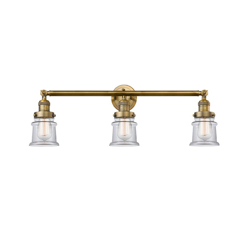 Canton Bath Vanity Light shown in the Brushed Brass finish with a Clear shade