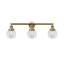 Beacon Bath Vanity Light shown in the Brushed Brass finish with a Clear shade