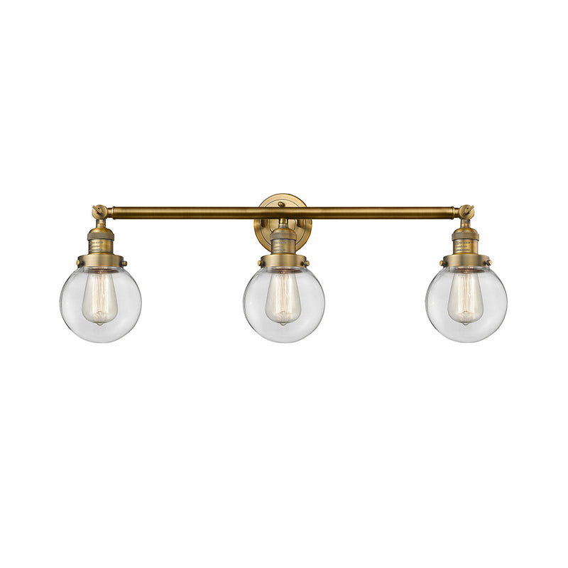 Beacon Bath Vanity Light shown in the Brushed Brass finish with a Clear shade