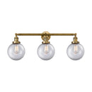 Beacon Bath Vanity Light shown in the Brushed Brass finish with a Clear shade