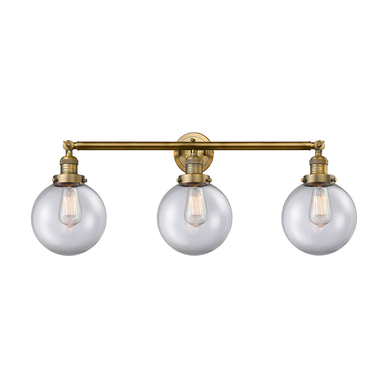 Beacon Bath Vanity Light shown in the Brushed Brass finish with a Clear shade