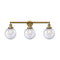 Beacon Bath Vanity Light shown in the Brushed Brass finish with a Seedy shade