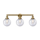 Beacon Bath Vanity Light shown in the Brushed Brass finish with a Seedy shade