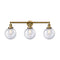 Beacon Bath Vanity Light shown in the Brushed Brass finish with a Seedy shade