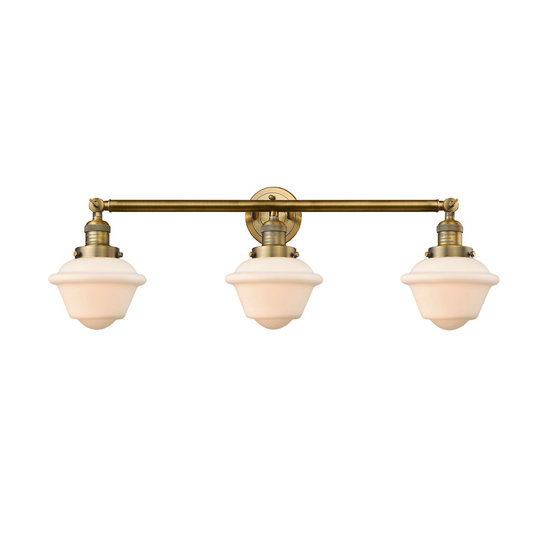 Oxford Bath Vanity Light shown in the Brushed Brass finish with a Matte White shade