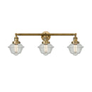 Oxford Bath Vanity Light shown in the Brushed Brass finish with a Seedy shade