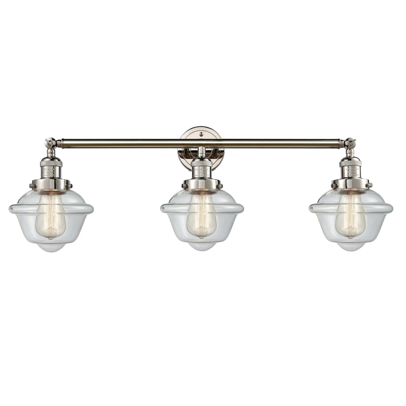 Oxford Bath Vanity Light shown in the Polished Nickel finish with a Clear shade