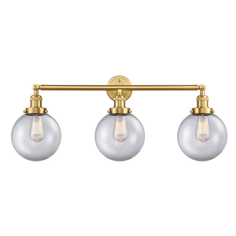 Beacon Bath Vanity Light shown in the Satin Gold finish with a Clear shade