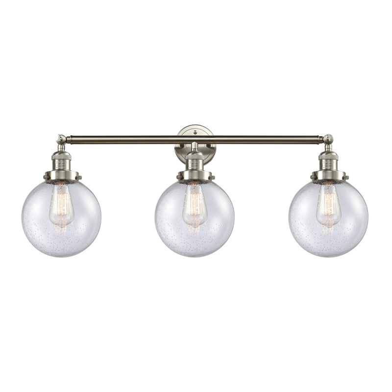 Beacon Bath Vanity Light shown in the Brushed Satin Nickel finish with a Seedy shade