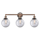 Beacon Bath Vanity Light shown in the Antique Copper finish with a Clear shade