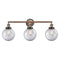 Beacon Bath Vanity Light shown in the Antique Copper finish with a Clear shade