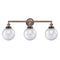 Beacon Bath Vanity Light shown in the Antique Copper finish with a Seedy shade