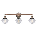 Oxford Bath Vanity Light shown in the Antique Copper finish with a Clear shade