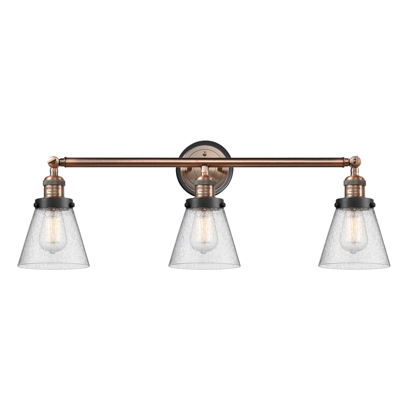 Cone Bath Vanity Light shown in the Antique Copper finish with a Seedy shade