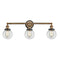 Beacon Bath Vanity Light shown in the Brushed Brass finish with a Clear shade