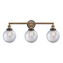 Beacon Bath Vanity Light shown in the Brushed Brass finish with a Clear shade