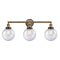 Beacon Bath Vanity Light shown in the Brushed Brass finish with a Seedy shade