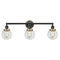 Beacon Bath Vanity Light shown in the Matte Black finish with a Clear shade