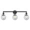 Beacon Bath Vanity Light shown in the Matte Black finish with a Seedy shade