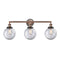 Beacon Bath Vanity Light shown in the Antique Copper finish with a Clear shade