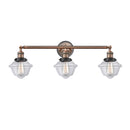 Oxford Bath Vanity Light shown in the Antique Copper finish with a Clear shade