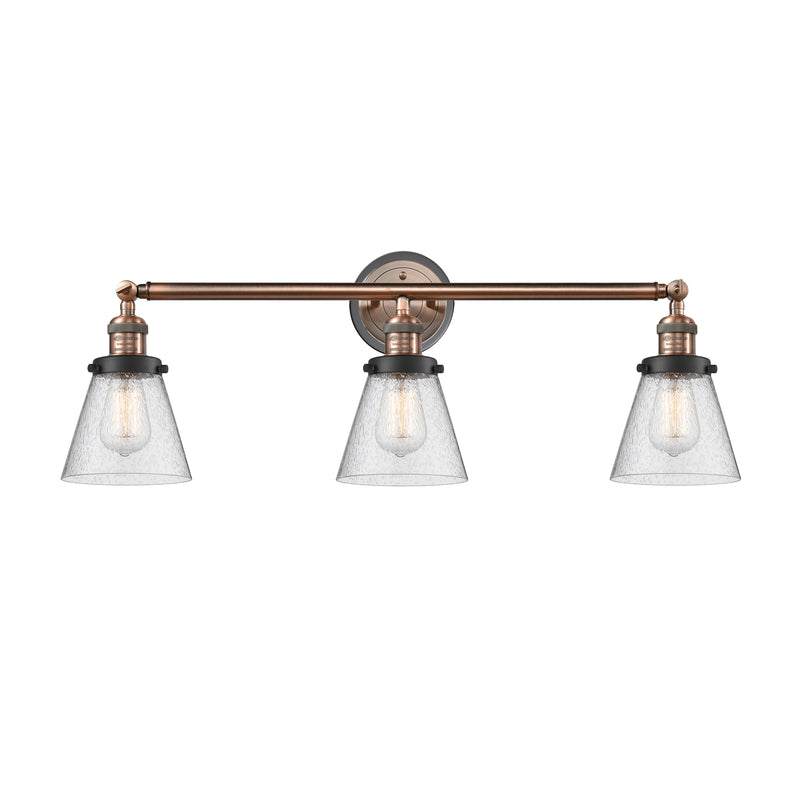 Cone Bath Vanity Light shown in the Antique Copper finish with a Seedy shade