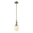 Beacon Mini Pendant shown in the Antique Brass finish with a Matte White shade