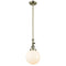 Beacon Mini Pendant shown in the Antique Brass finish with a Matte White shade