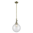 Beacon Mini Pendant shown in the Antique Brass finish with a Clear shade