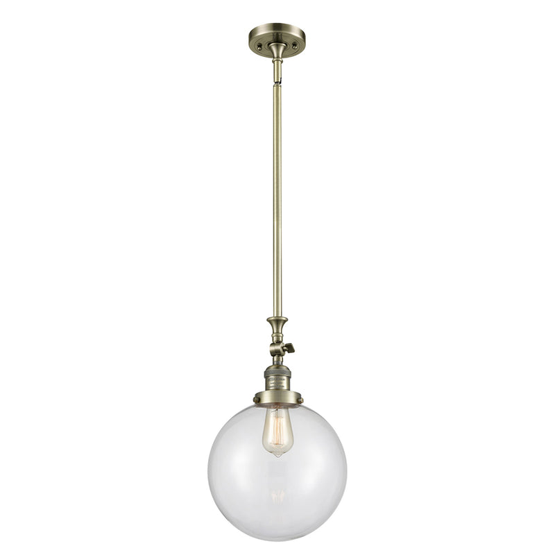 Beacon Mini Pendant shown in the Antique Brass finish with a Clear shade