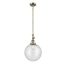 Beacon Mini Pendant shown in the Antique Brass finish with a Seedy shade