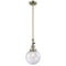 Beacon Mini Pendant shown in the Antique Brass finish with a Seedy shade